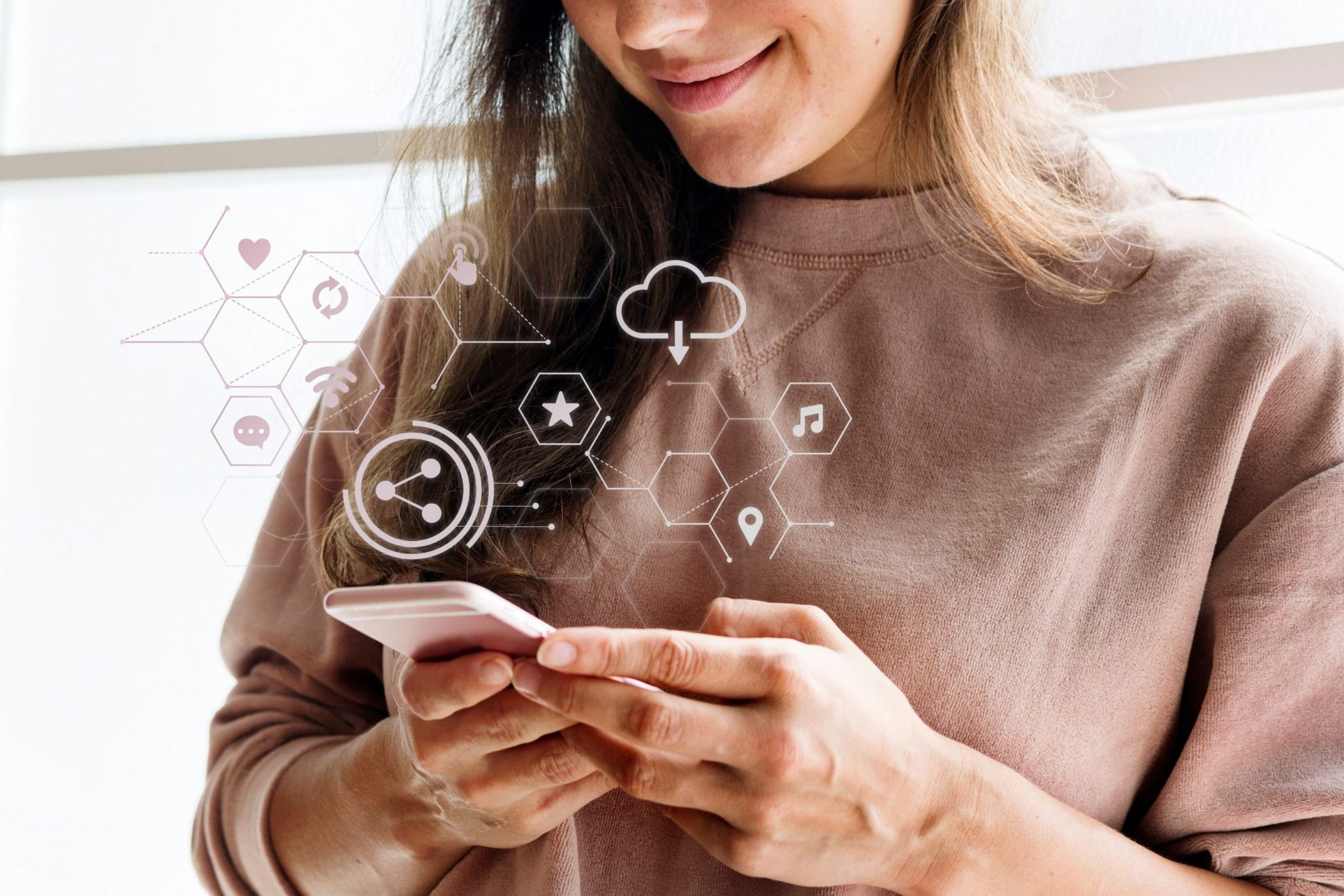 Photo of woman smiling looking at smartphone illustrates blog: "5 Books to Understand the Future of Digital Marketing"