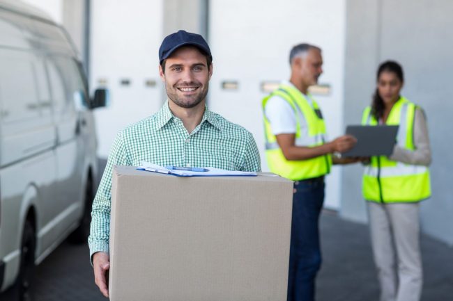 Photo of man delivering box illustrates blog "How to Create a Content Strategy for Your Small Business"