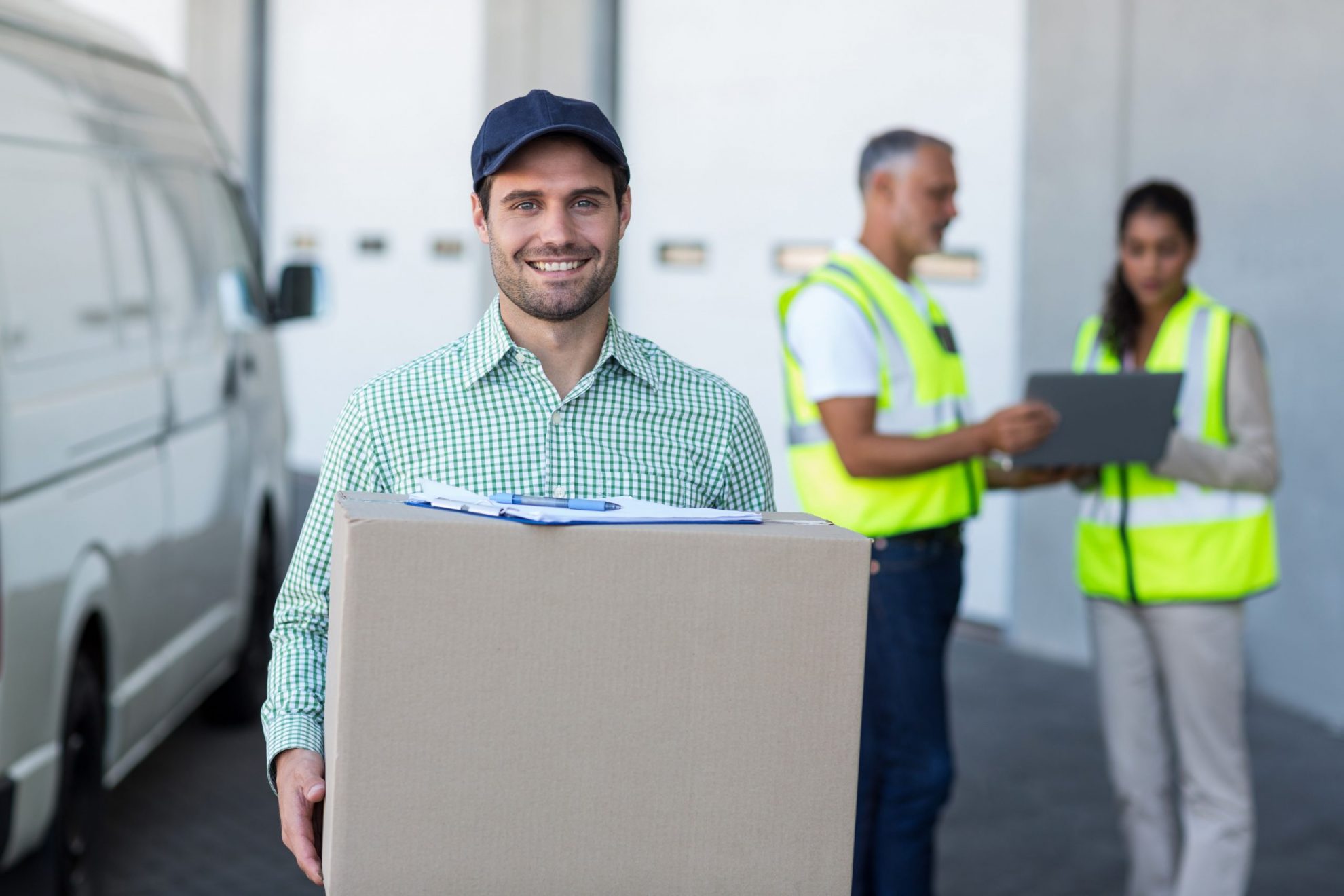 Photo of man delivering box illustrates blog "How to Create a Content Strategy for Your Small Business"