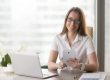 Photo of smiling woman in office illustrates blog: "7 Content Marketing Tips to Supercharge Your Sales in 2022"